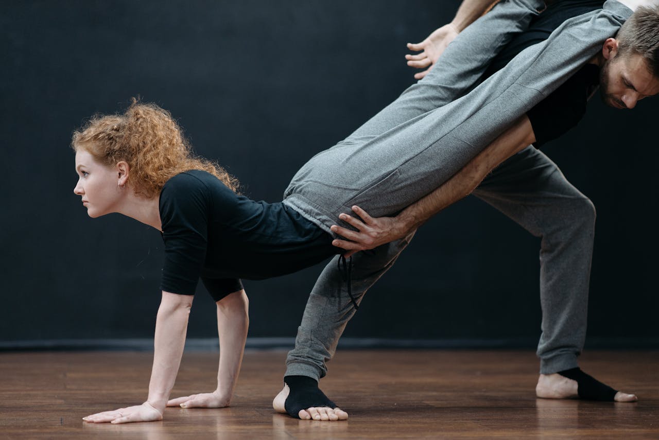 Ballet dancers showcasing flexibility and posture in studio performance practice.